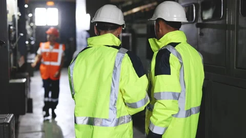 Back View of Two Engineers Stand in Electric Power Station, Use Digital Tablet Stock Footage 194627544