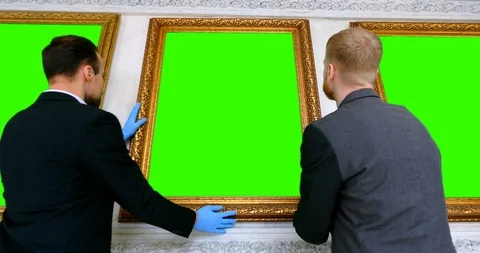 Back view of two museum workers inspecting painting Video stock 111215259