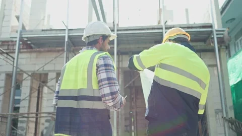 Back view, Two professional male civil engineer or Architect, inspector with  Video stock 213989713