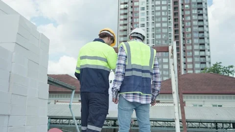 Back view, Two professional male civil engineer or Architect, inspector with  Video stock 213993114