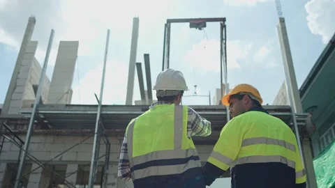 Back view, Two professional male civil engineer or Architect, inspector with  Video stock 217748823