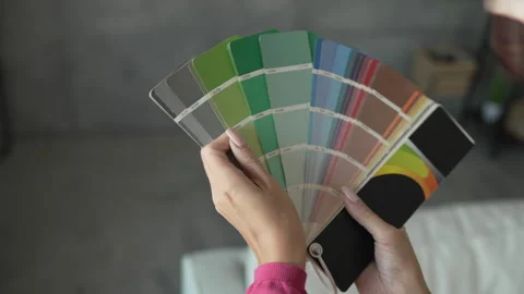 Back view of unknown woman hold green color palette at home Stock Footage 292557271