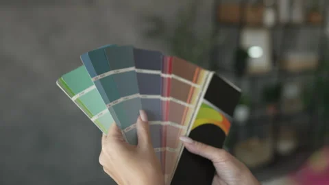 Back view of unknown woman hold blue color palette at home Stock Footage 292558827