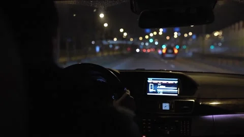Back view of unrecognizable young man hold hands on steering wheel and drivie Stock Footage 145754490