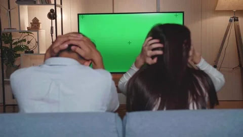 Back View Of Upset Young Asian Couple Is Frustrated About The Loss Of The Team Video stock 161027128