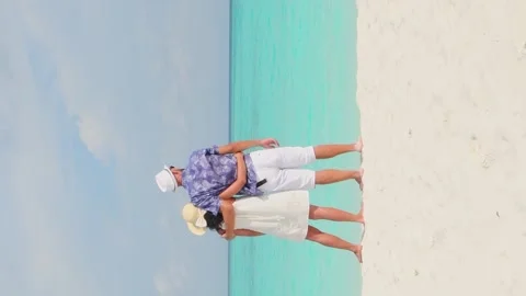 Back view vertical beautiful tourist caucasian couple in white summer cloth.. Stock Footage 278266096