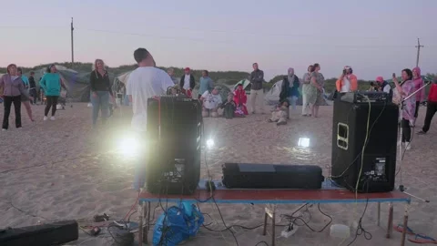 Back view of violinist playing the violin on the beach. People listen to music Stock Footage 139858188
