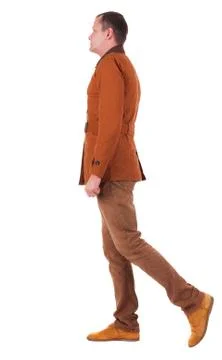 Back view of walking  handsome man in jeans and jacket Foto stock