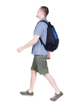 Back view of walking  man  with backpack Stock Photos