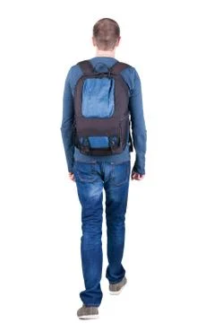 Back view of walking  man  with backpack Stock Photos