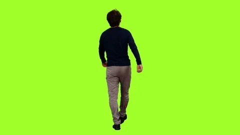 Back view of a walking man on green screen background, Chroma key Stock Footage
