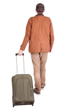 Back view of walking  man  with suitcase Stock Photos