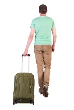 Back view of walking  man  with suitcase Stock Photos