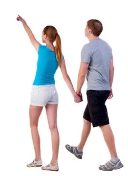 Back view of walking young couple Stock-Fotos