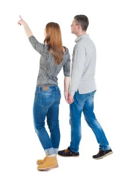 Back view of walking young couple Stock Photos