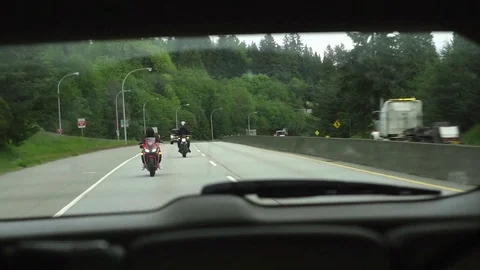 Back View Window View of Motorcyclists on a Highway Vídeos de archivo 107442225