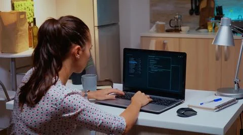 Back view of woman hacker coding a dangerous virus Stock-Fotos