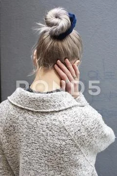 Back View Of A Woman With Hair Done Up In A Bun, Vertical