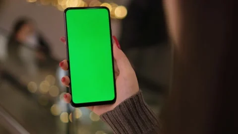 Back View of Woman at Phone with Green Screen for Copy Space. Chromakey Mock Up Video stock 185857504