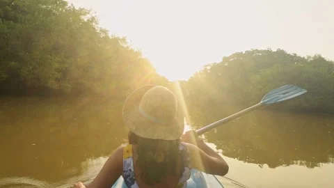 Back view woman sit in double blue kayak. Couple kayaks on calm waters of T.. Stock-Footage 334281332