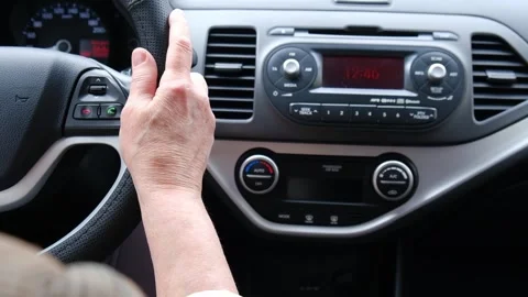 Back view of woman's hands driving car. Stock Footage 242091573