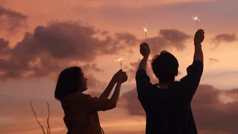 Back view. Young Asian couple having fun and enjoy celebrate Stock Footage 124349133
