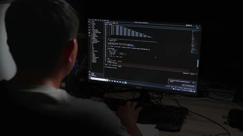 Back view young asian man sitting at desk using computer programming debugg.. Stock Footage 228953864