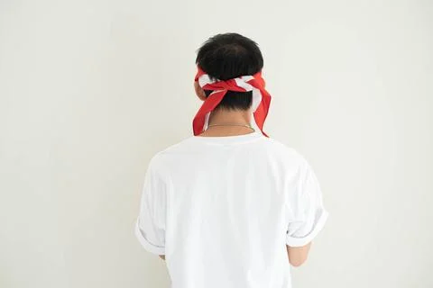 Back view of a young Asian man wearing a white T-shirt and Kemerdekaan Indo.. Stock Photos