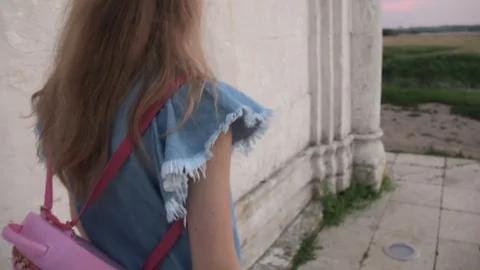 Back view of Young Beautifull Blond Woman travelling to Church of the Stock Footage 92460981