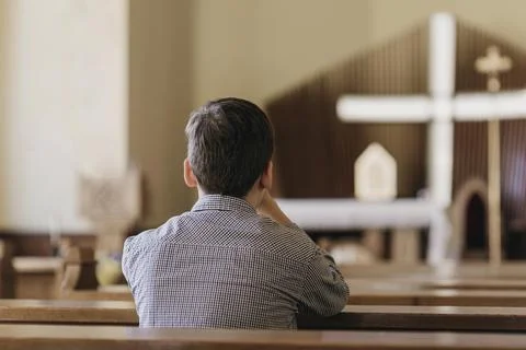 Back view young boy praying church High resolution photo Stock Photos