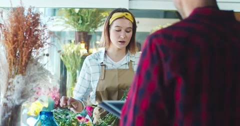 Back view of young Caucasian man worker using tablet to check availability of Stock Footage 138745385