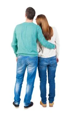 Back view of young embracing couple Stock Photos