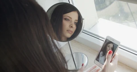 Back view of young lady taking photo by mobile phone. Stock Footage 127284452