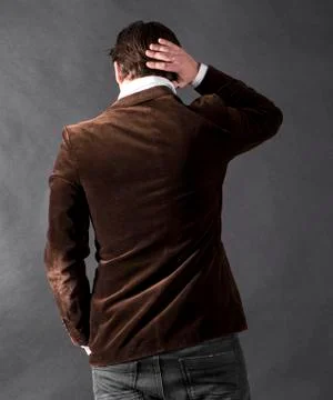 Back view of young man on a dark background Stock-Fotos
