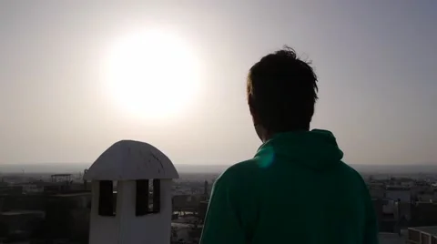 Back view of young man looking at sunset, medina, morocco 库存影片 59615930