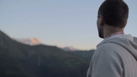 Back view of young man looking at panorama in nature mountain outdoor Stockbeeldmateriaal 64543607
