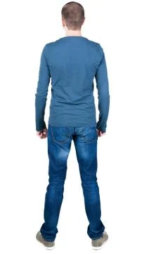 Back view of young man in t-shirt and jeans  looking Stock-Fotos