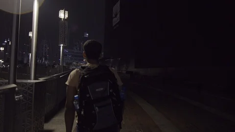 Back view of a young man walking at city... | Stock Video | Pond5