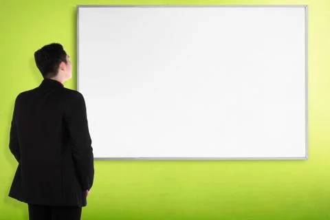 Back view young man with white board Stock Photos