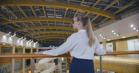 Back view of young manager standing in business center Stock Footage 127157627