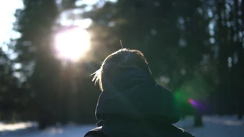 Back view of young men with backpack walking in winter snowy forest. Stock Footage 93329120
