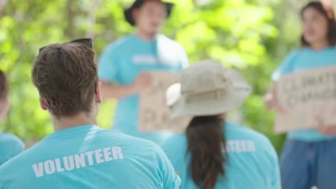 Back view of young men listening about loving the environment at Volunteer Camp Stock-Footage 219524731