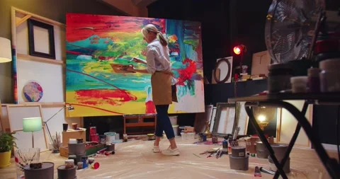 Back view of young talented concentrated Caucasian female professional artist Stock Footage 149580895