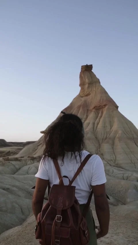 Back view young unrecognizable African afro backpacker enjoying day off to Stock Footage 274421162