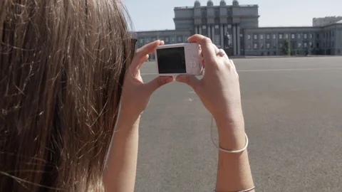 Back view of young white caucasian woman with long dark hair standing on Kuibysh Stock Footage 94855771
