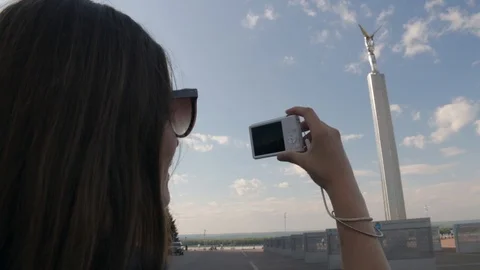 Back view of young white caucasian woman with long dark hair standing on Glory s Stock Footage 94855917