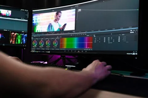 Back view of a young white man video editor Stock Photos