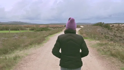 Back View of Young Woman Walking  On Path in nature in autumn 스톡 동영상 166468913