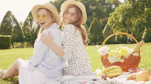 Back view.Two young beautiful hipster woman in trendy summer sundress Stock Footage 142571201