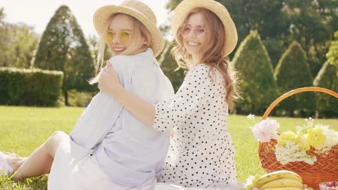 Back view.Two young beautiful hipster woman in trendy summer sundress Stock Footage 142571202